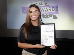 Chloe McCann with her certificate as a finalist for the New to Social Care Award