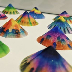 Artwork by Nicola Doole called 'Equal but Unique'. his piece represents how we should all be equal and celebrates how we are all completely unique. Tie-dye, fabric manipulation on canvas.