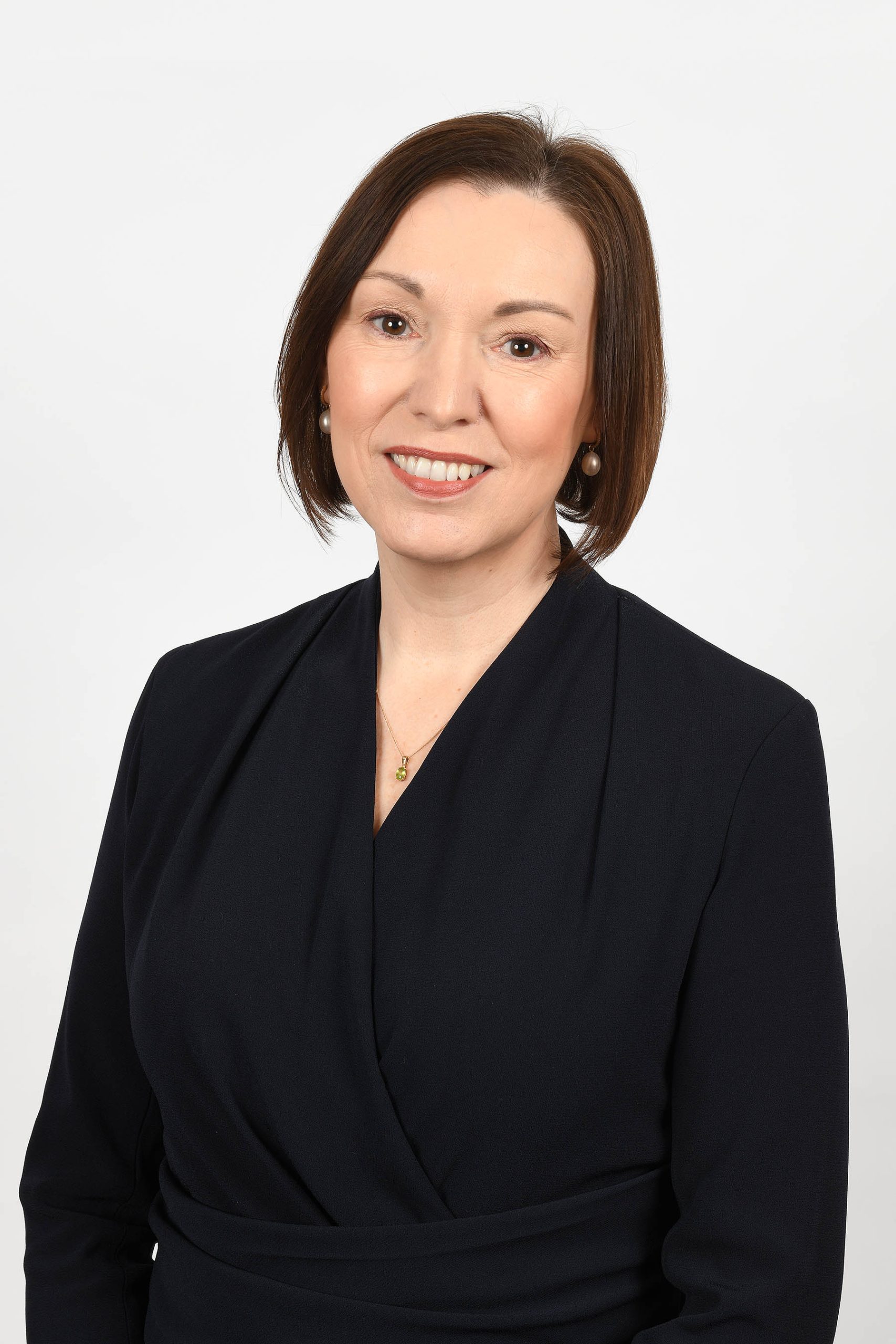 Headshot of Jennifer Welsh smiling to camera.