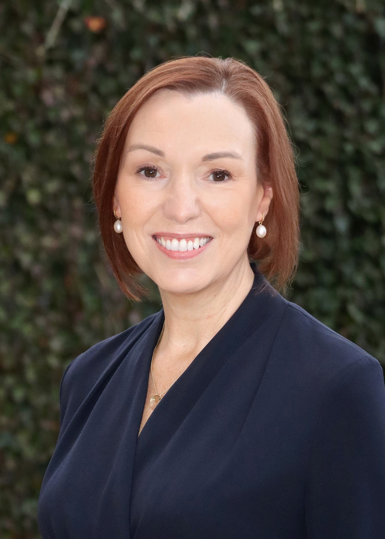 Headshot of Jennifer Welsh smiling to camera.
