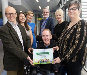 Pictured (Left to Right) Alistair Campbell Director of Performance, Planning & Informatics, Belfast Trust, Ellen Ilot from AccessAble, Orla Barron, Interim Co-Director of Planning and Equality, Belfast Trust, David Porter, Director of Strategic Development, Belfast Trust, patient and service user Conor O'Kane, Estella Dorrian, Senior Equality and Planning Manager, Belfast Trust, and Siobhan O'Kane, Conor's mum.