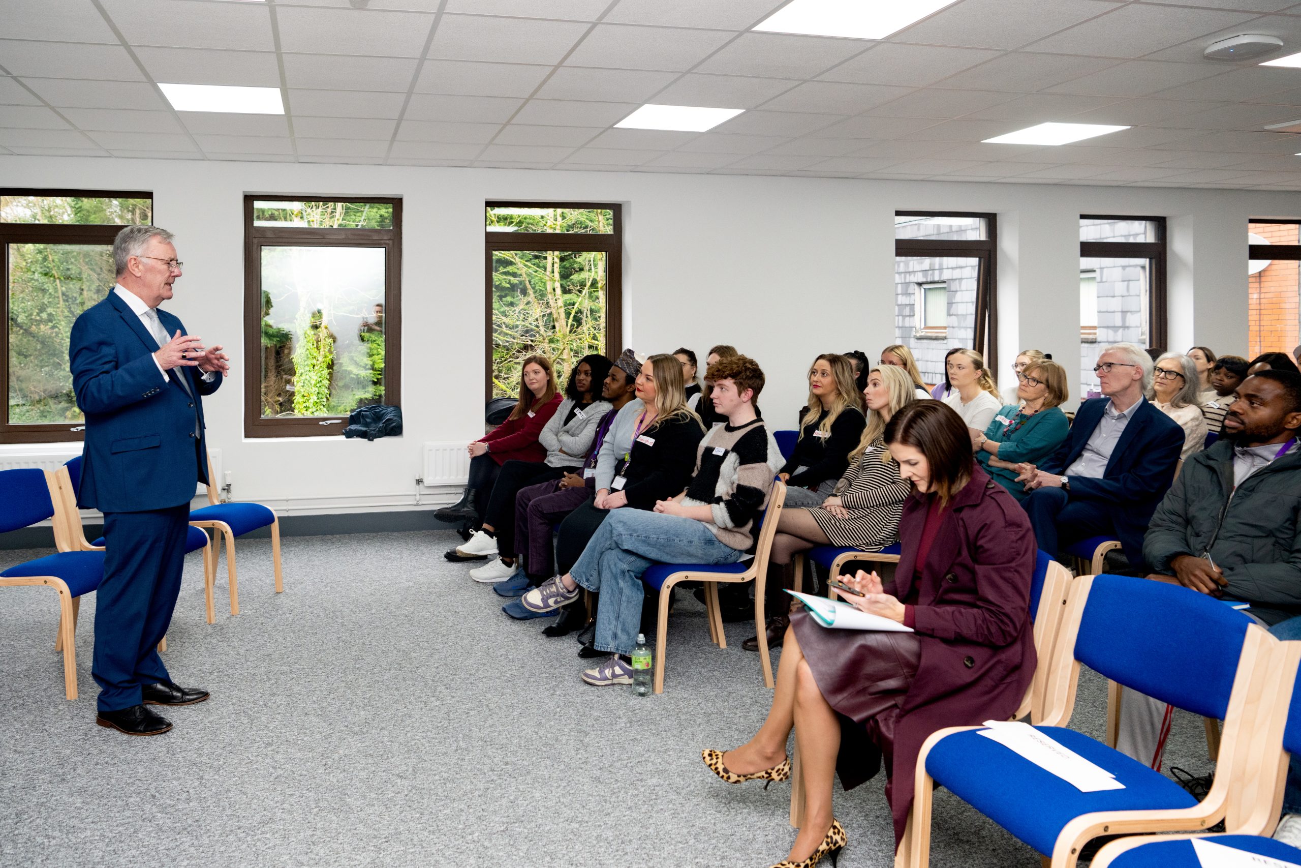 Health Minister Mike Nesbitt addresses the room of social work staff.